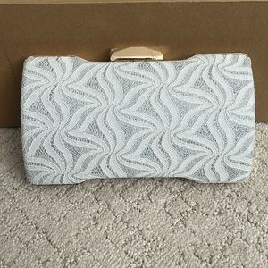 Silver lace and gold clutch